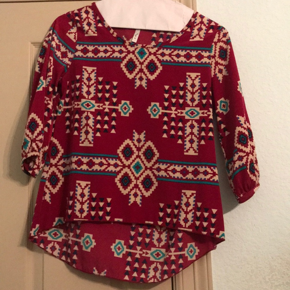 Red blouse. Tribal pattern